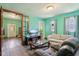 Open-concept living room with lots of light, comfortable seating and open doorway at 1129 Trowbridge St, Indianapolis, IN 46203
