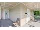 Covered porch with chairs offers a cozy space for relaxation and enjoying the outdoors at 1129 Trowbridge St, Indianapolis, IN 46203