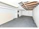 Bright unfinished basement with painted concrete walls and floor, exposed ceiling and doorway at 114 South St, Southport, IN 46227