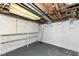 Unfinished basement features painted cinder block walls and exposed ductwork at 114 South St, Southport, IN 46227