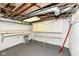Spacious unfinished basement area with painted walls, exposed ceiling, and built-in shelving at 114 South St, Southport, IN 46227