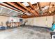 Attached garage with workbench, storage and open ceiling at 114 South St, Southport, IN 46227