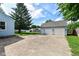 Detached two car garage with a large driveway at 114 South St, Southport, IN 46227