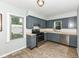 Cozy kitchen with gray cabinetry and stainless steel appliances at 114 South St, Southport, IN 46227