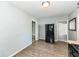 Bright kitchen features wood-look flooring and stainless steel refrigerator at 114 South St, Southport, IN 46227