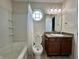 Well-lit bathroom with a bathtub, shower, and vanity, offering essential amenities in a compact space at 1202 Tomahawk Pl, Martinsville, IN 46151
