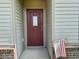 Inviting front door with decorative window and American flag, set in a cozy entrance at 1202 Tomahawk Pl, Martinsville, IN 46151