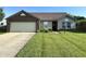 Charming single-story home featuring a well-manicured lawn and attached two-car garage at 1202 Tomahawk Pl, Martinsville, IN 46151
