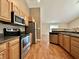 This spacious kitchen features modern appliances and opens to a bright living area with outdoor access at 1202 Tomahawk Pl, Martinsville, IN 46151