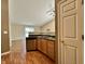 Bright kitchen featuring wooden cabinets, stainless steel appliances, and access to an open living space at 1202 Tomahawk Pl, Martinsville, IN 46151