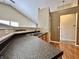 Practical kitchen featuring a double sink, plenty of counter space, and hardwood floors at 1202 Tomahawk Pl, Martinsville, IN 46151