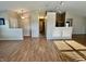 Open concept living area with high ceilings, hardwood floors, and modern lighting fixtures at 1202 Tomahawk Pl, Martinsville, IN 46151