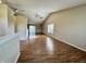 Open-concept living room featuring vaulted ceilings and sliding glass doors to the back at 1202 Tomahawk Pl, Martinsville, IN 46151