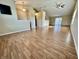 Bright living room showcases hardwood floors, neutral walls, and vaulted ceilings at 1202 Tomahawk Pl, Martinsville, IN 46151