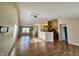 Open-concept space with living room and kitchen featuring hardwood floors and lots of natural light at 1202 Tomahawk Pl, Martinsville, IN 46151