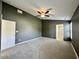 Spacious main bedroom with gray walls, a ceiling fan, and carpet at 1202 Tomahawk Pl, Martinsville, IN 46151