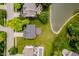 Birds eye view of property featuring lush lawn, mature trees, lake access and private deck for outdoor gatherings at 12490 Windbush Way, Carmel, IN 46033