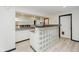 Basement bar area with mirrored backsplash, tile counter and glass block base at 12490 Windbush Way, Carmel, IN 46033