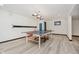 Finished basement features a new floor and a ping pong table and lighting fixtures at 12490 Windbush Way, Carmel, IN 46033