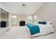 Bright bedroom with a sloped ceiling, large windows, mirrored closet doors, and comfortable furnishings at 12490 Windbush Way, Carmel, IN 46033