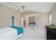 Cozy bedroom with a ceiling fan, large closet, and calm paint color at 12490 Windbush Way, Carmel, IN 46033