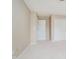Bedroom featuring neutral walls, carpet, a closet, and view into hallway at 12490 Windbush Way, Carmel, IN 46033