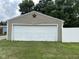 Detached garage with a white garage door and exterior star decoration at 1395 Evans Ave, Noblesville, IN 46060