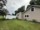 Side yard with green lawn and a bright white privacy fence at 1395 Evans Ave, Noblesville, IN 46060