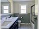 A beautifully updated bathroom featuring double sinks and modern fixtures at 1400 Evelyn Ln, Anderson, IN 46017