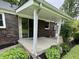 Covered back patio with a sliding glass door entry to the home at 1400 Evelyn Ln, Anderson, IN 46017