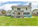Spacious backyard featuring a pergola, dining set, and blue chairs for relaxing outside at 15075 Windsor Ln, Noblesville, IN 46060