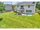 Spacious backyard with lush green grass, patio area, and a charming pergola, perfect for outdoor relaxation at 15075 Windsor Ln, Noblesville, IN 46060