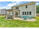 Charming backyard patio with a pergola, outdoor seating, and a fire pit, perfect for entertaining at 15075 Windsor Ln, Noblesville, IN 46060