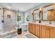 Modern bathroom featuring a soaking tub, glass shower, and double vanity at 15075 Windsor Ln, Noblesville, IN 46060