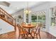 Charming dining area with hardwood floors, natural light, and sliding doors to the backyard at 15075 Windsor Ln, Noblesville, IN 46060