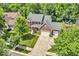 Beautiful two-story brick home with a well-manicured lawn and mature trees at 15075 Windsor Ln, Noblesville, IN 46060