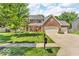 Beautiful brick two-story home with a manicured lawn and a three-car garage at 15075 Windsor Ln, Noblesville, IN 46060