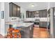 Stylish kitchen with grey cabinets, stainless steel appliances, and marble countertops at 15075 Windsor Ln, Noblesville, IN 46060
