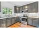 Well-lit kitchen featuring modern appliances and ample counter space at 15075 Windsor Ln, Noblesville, IN 46060