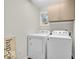 Functional laundry room with a window and a washer and dryer at 15075 Windsor Ln, Noblesville, IN 46060