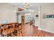 Open-concept living area with hardwood floors leading to an adjacent dining room at 15075 Windsor Ln, Noblesville, IN 46060