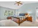Cozy main bedroom with high ceilings, large window, and wooden furniture at 15075 Windsor Ln, Noblesville, IN 46060