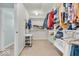 Organized walk-in closet featuring built-in shelving and ample hanging space for clothes and accessories at 15075 Windsor Ln, Noblesville, IN 46060