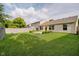 This large backyard features a well-kept lawn, a patio, and privacy fencing for outdoor relaxation at 16629 Greensboro Dr, Westfield, IN 46074