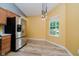 Bright kitchen nook with stainless steel refrigerator and a large window view at 16629 Greensboro Dr, Westfield, IN 46074