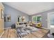 Bright living room with vaulted ceilings, wood floors, contemporary furniture, and lots of natural light at 16629 Greensboro Dr, Westfield, IN 46074