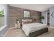 Stylish main bedroom features wood accent wall, neutral color palette, and cozy decor at 16629 Greensboro Dr, Westfield, IN 46074