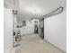 A clean basement featuring updated utilities, exposed duct work and freshly painted walls at 1739 N Alton Ave, Indianapolis, IN 46222