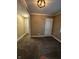 A carpeted bedroom has neutral walls, white trim, and doors leading to other rooms at 1810 N Parker Ave, Indianapolis, IN 46218