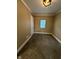 A carpeted empty bedroom has neutral walls, white trim, and a window with white blinds at 1810 N Parker Ave, Indianapolis, IN 46218